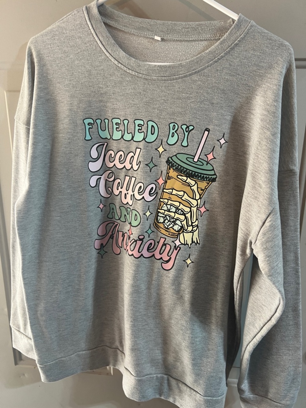 Grey Sweatshirt with Pastel 'Fueled by Iced Coffee and Anxiety' Graphic